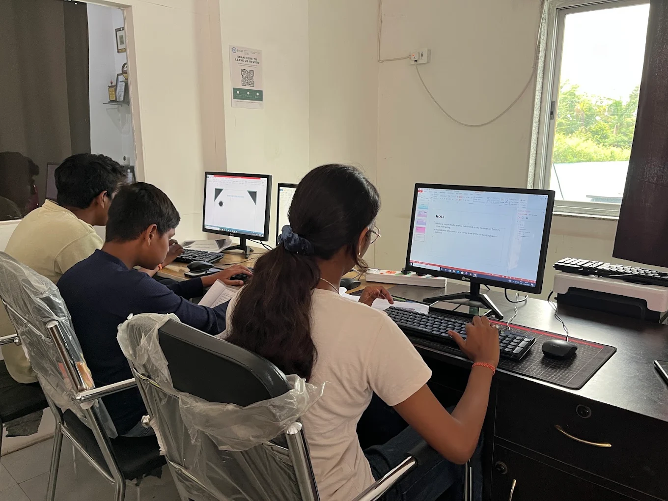 Students learning on computers at Best Computer